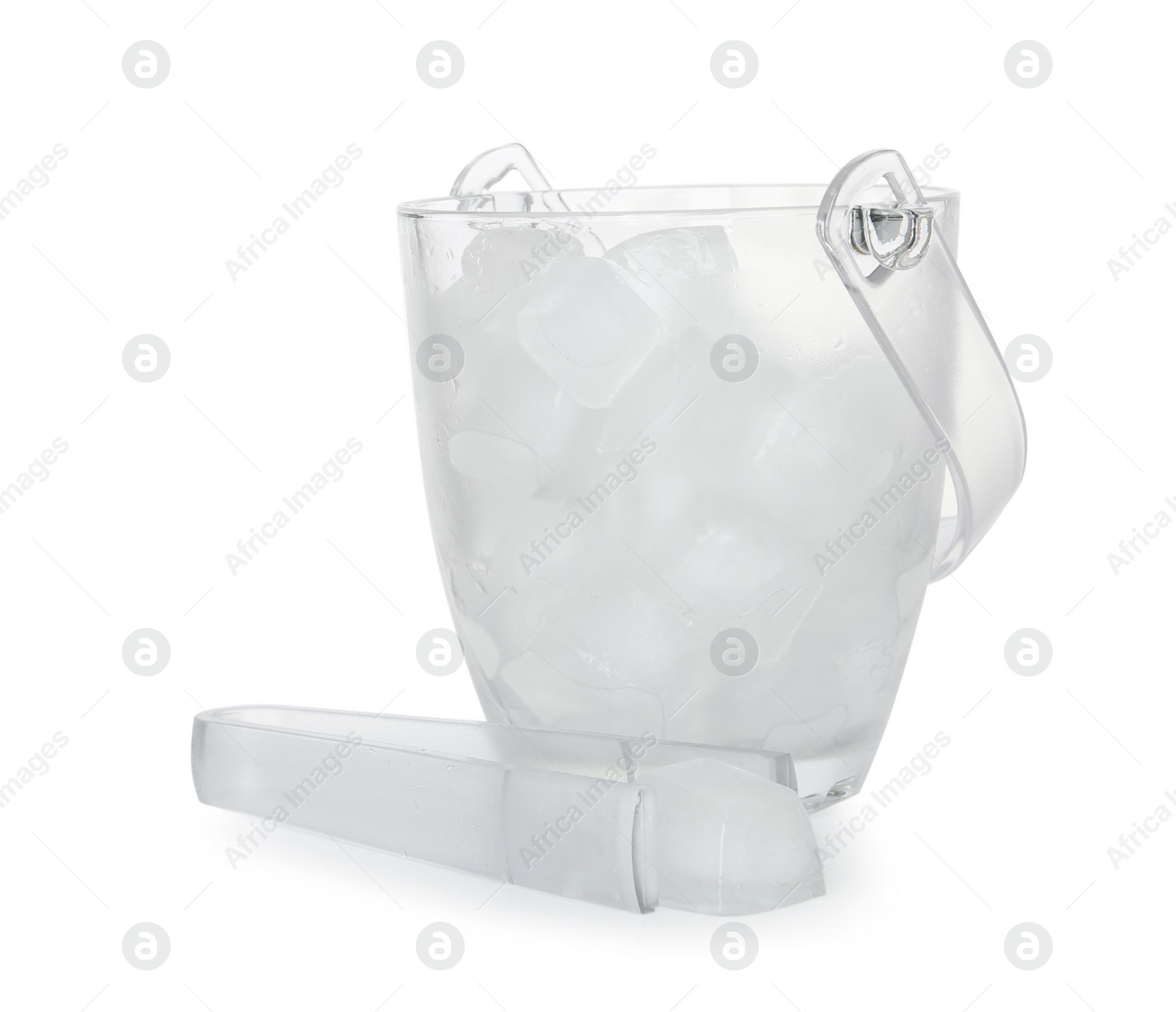 Photo of Glass bucket with ice cubes and tongs on white background