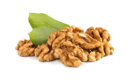 Photo of Pile of peeled walnuts with leaves on white background