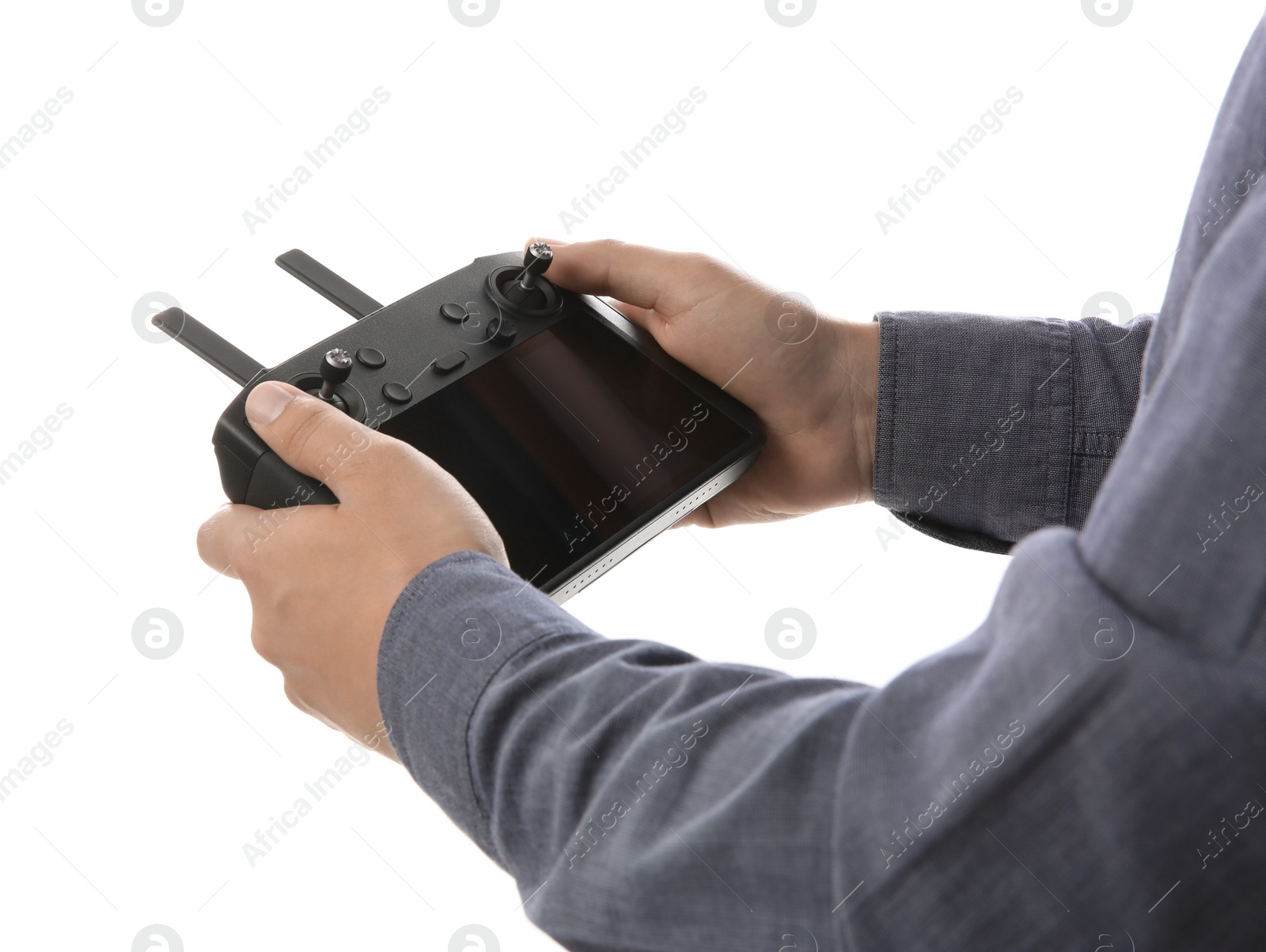 Photo of Man holding new modern drone controller on white background, closeup of hands