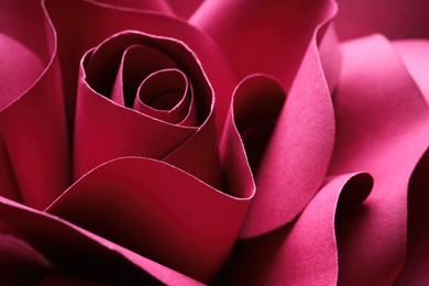 Photo of Beautiful red flower made of paper as background, closeup