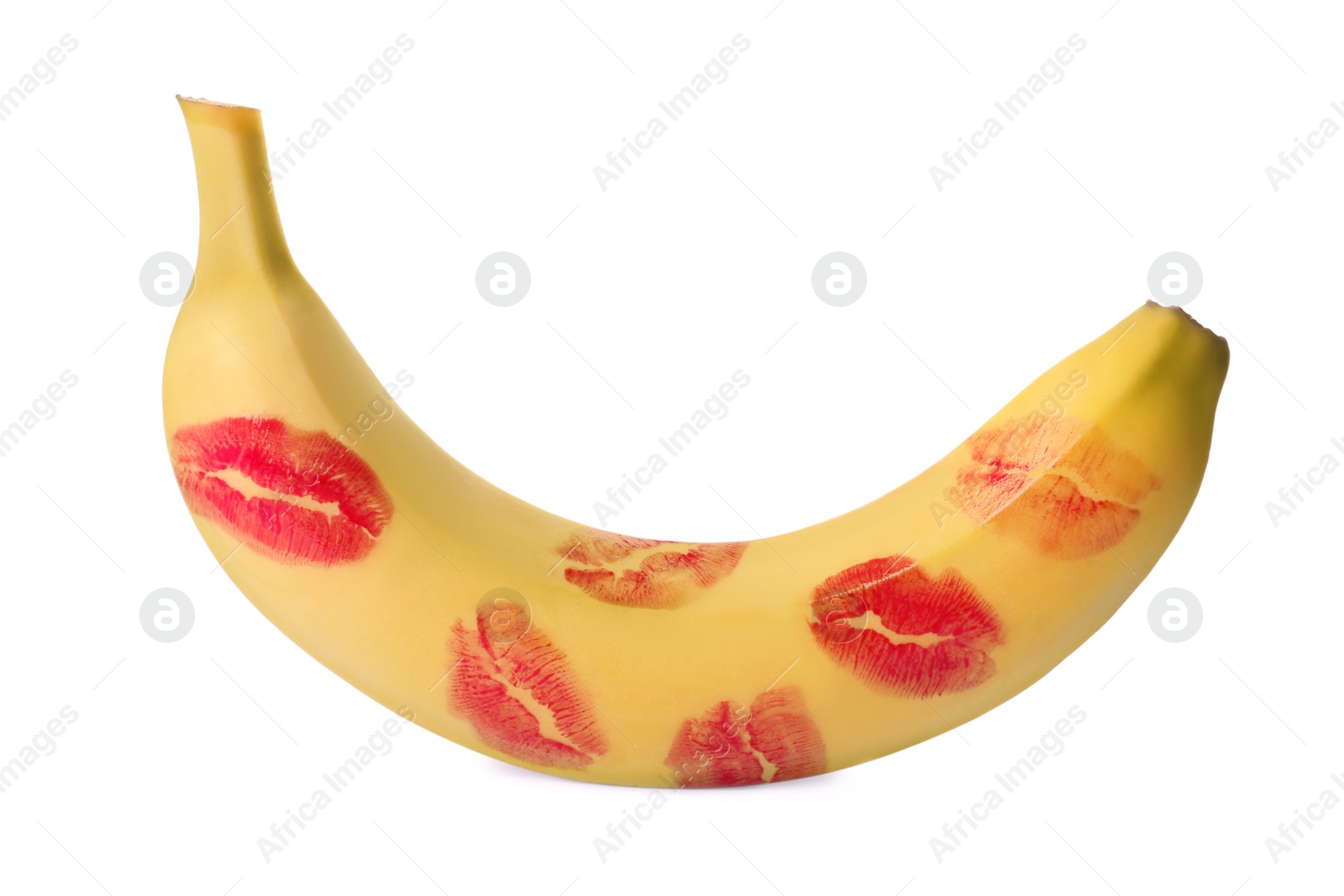 Photo of Banana covered with red lipstick marks isolated on white. Potency concept