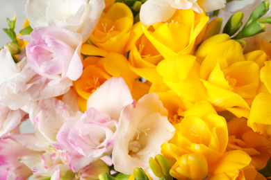 Photo of Beautiful colorful freesia bouquet as background, closeup