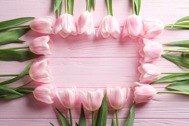 Photo of Composition with beautiful tulips for Mother's Day on wooden background, top view