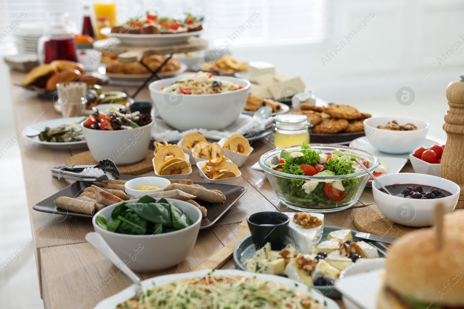 Photo of Brunch table setting with different delicious food indoors