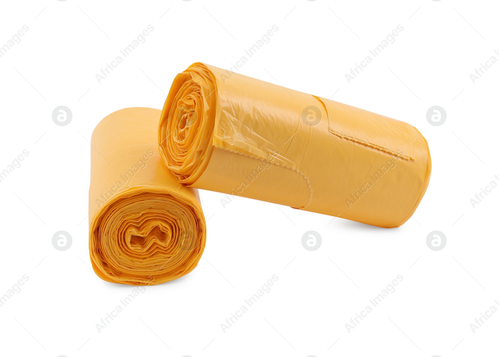 Photo of Two rolls of yellow garbage bags isolated on white