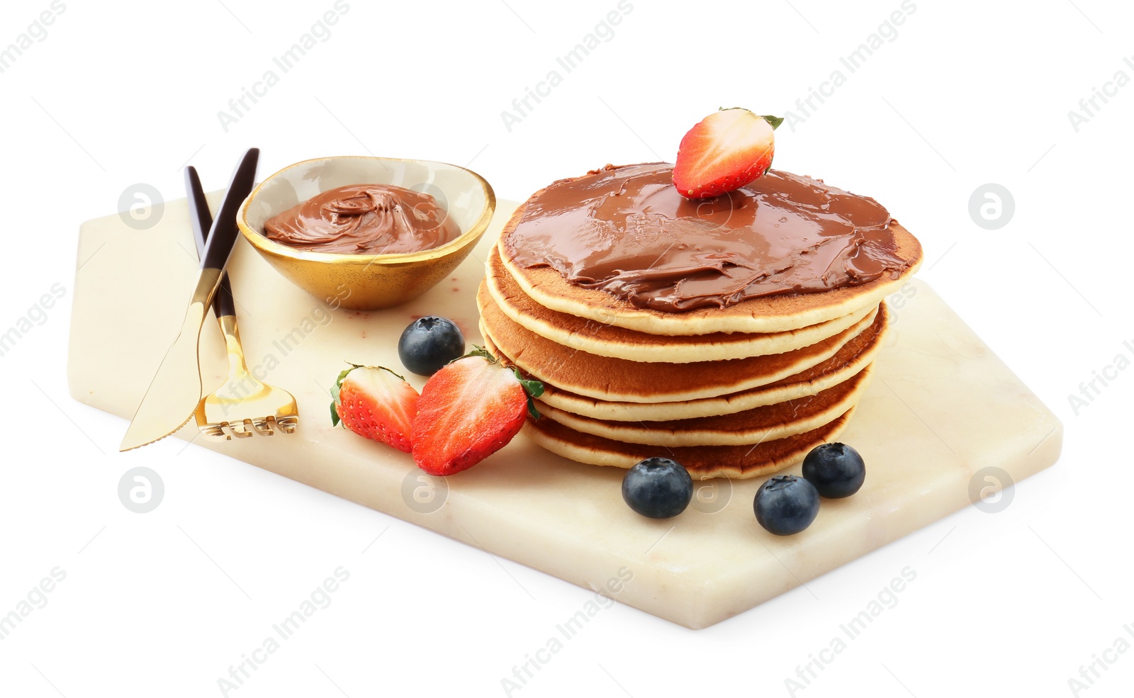 Photo of Delicious pancakes with chocolate paste, berries and cutlery isolated on white