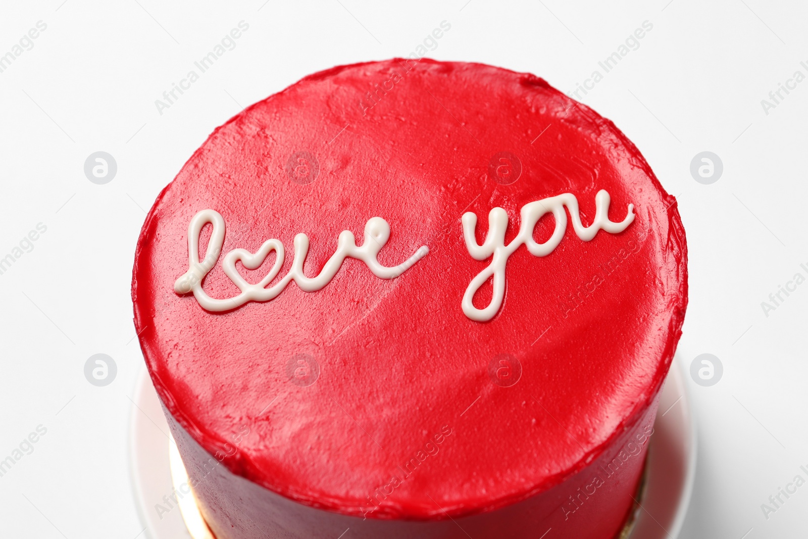 Photo of Bento cake with text Love You on white table, closeup. St. Valentine's day surprise