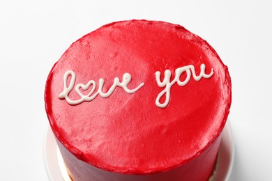 Photo of Bento cake with text Love You on white table, closeup. St. Valentine's day surprise