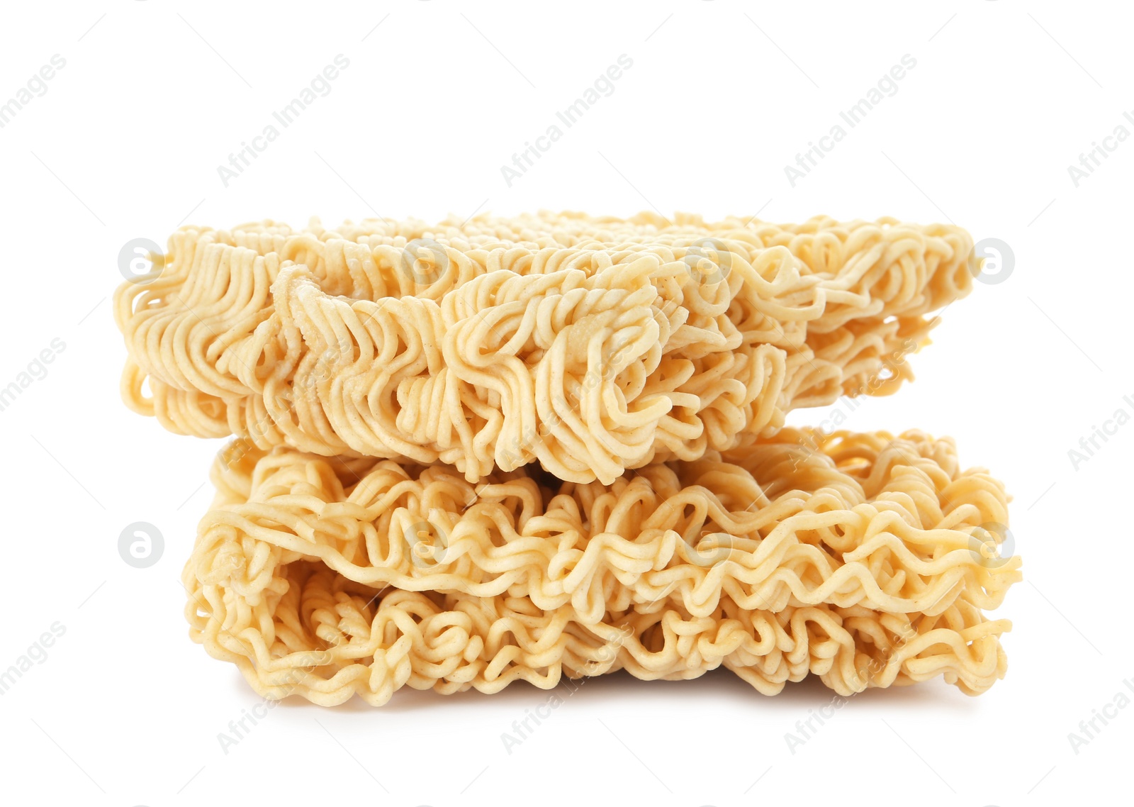 Photo of Blocks of quick cooking noodles isolated on white