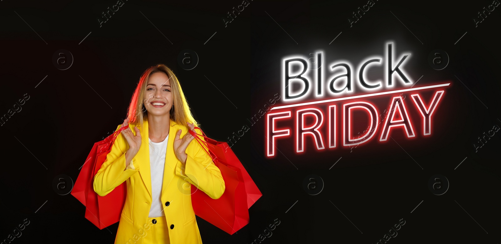 Image of Black Friday Sale. Beautiful young woman with shopping bags on dark background, banner design 