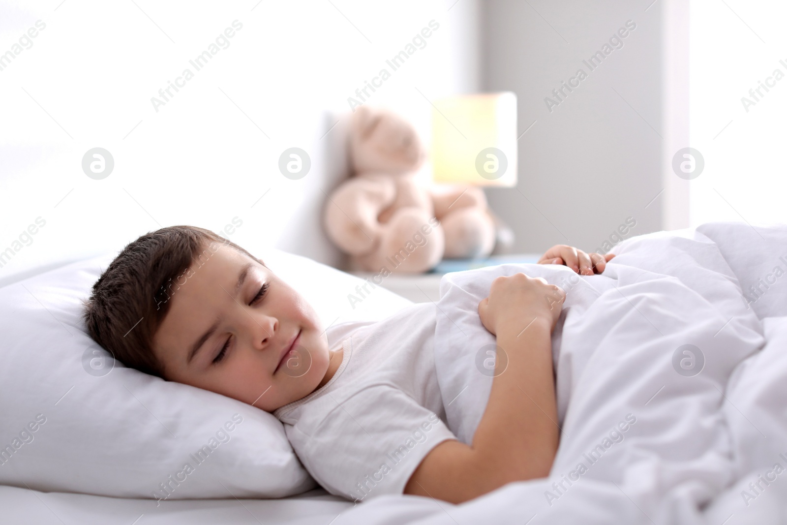 Photo of Cute little boy sleeping at home. Bedtime