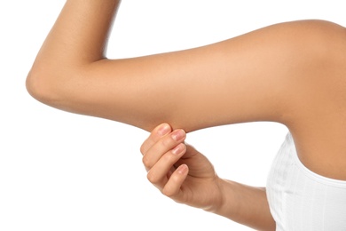 Photo of Young woman drawing attention to arm on white background, closeup. Plastic surgery concept