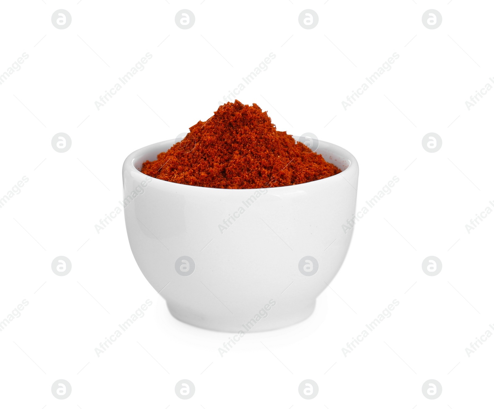 Photo of Bowl with aromatic paprika powder isolated on white