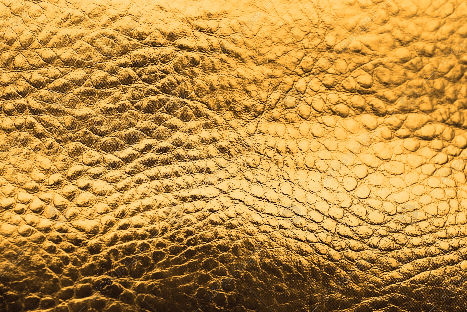 Image of Golden textured surface as background, closeup view