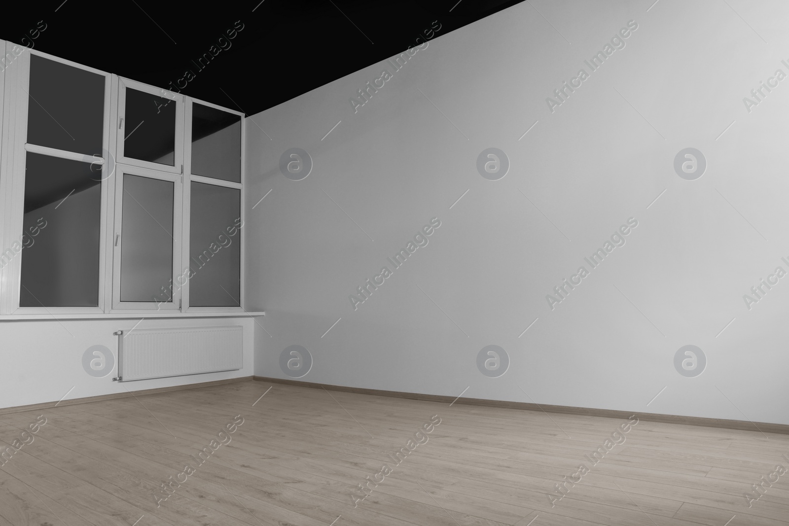 Photo of New empty room with clean windows and white walls