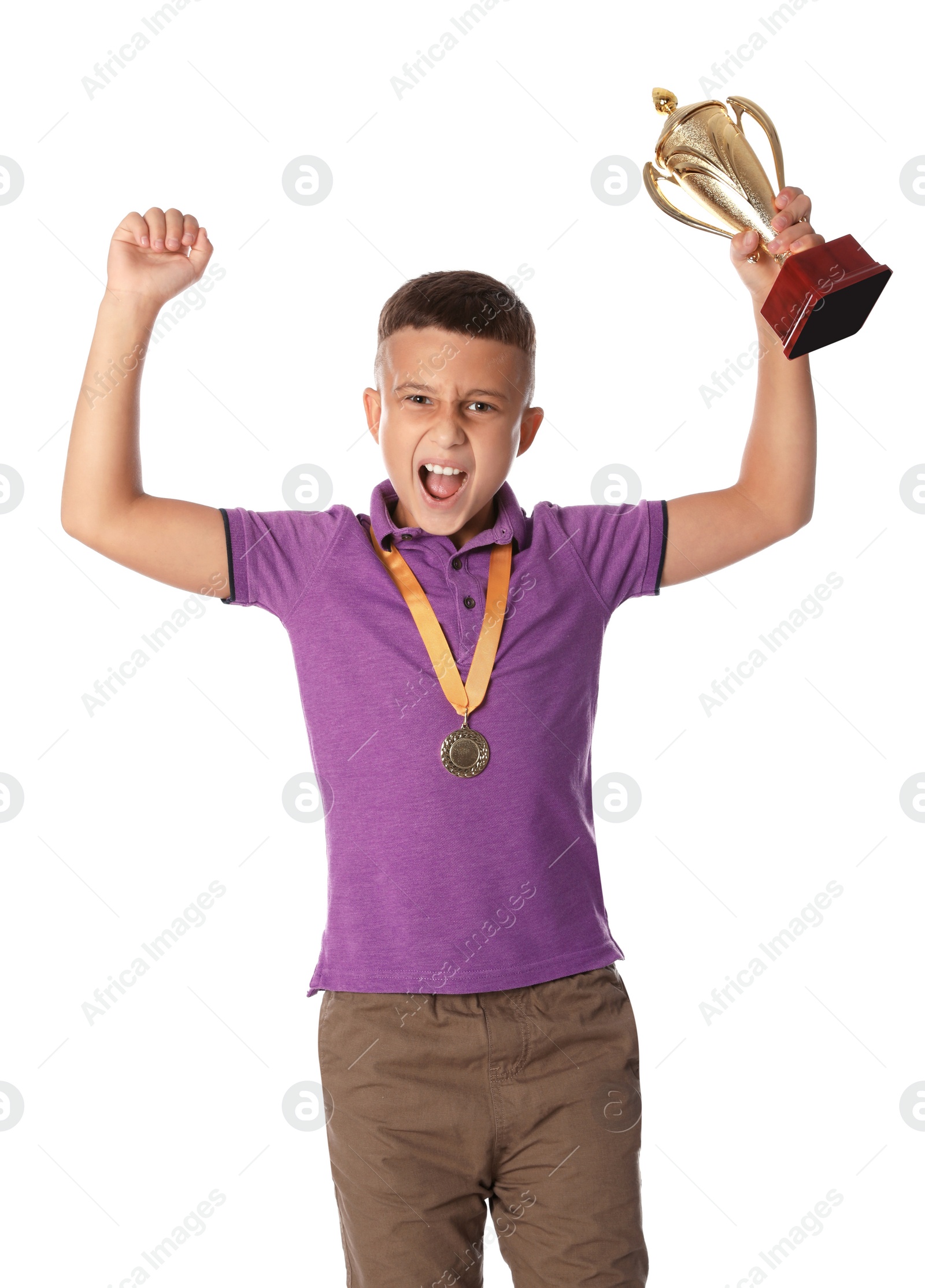 Photo of Happy boy with golden winning cup and medal on white background