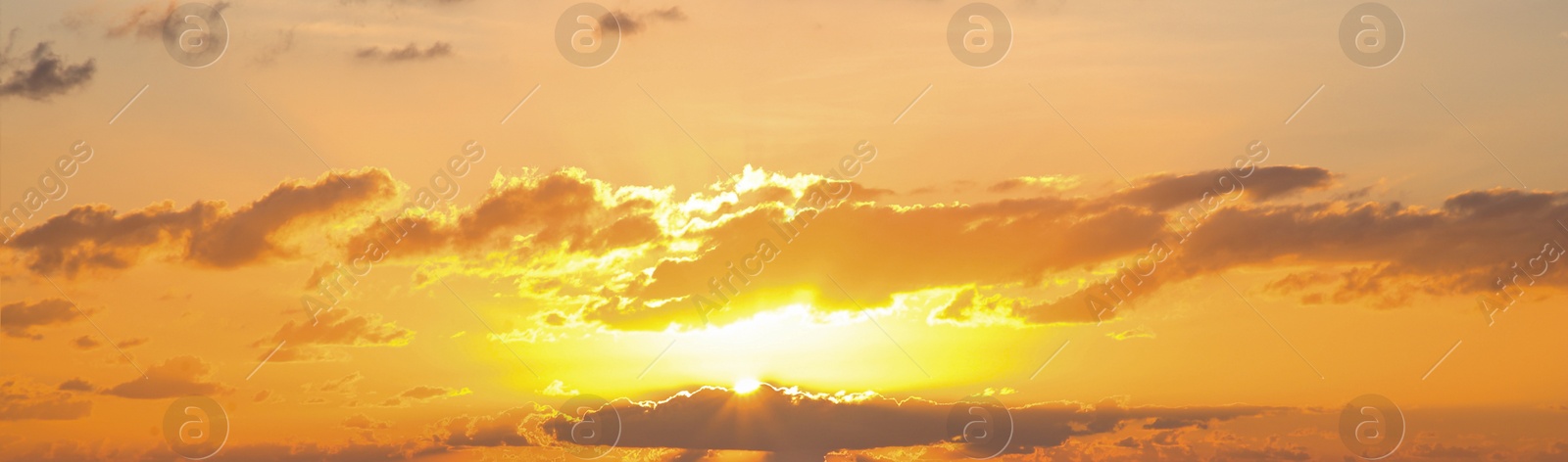 Image of Sun shining through clouds on beautiful sky, banner design