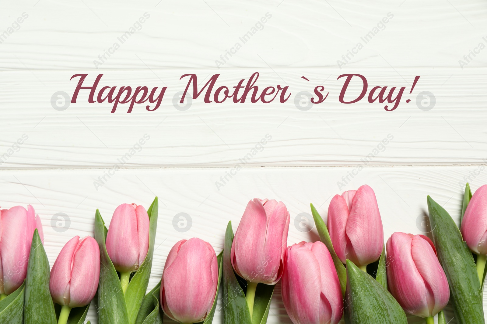 Image of Happy Mother's Day greeting card. Beautiful tulip flowers on white wooden background