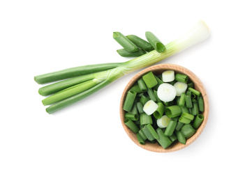 Photo of Fresh green spring onions isolated on white, top view