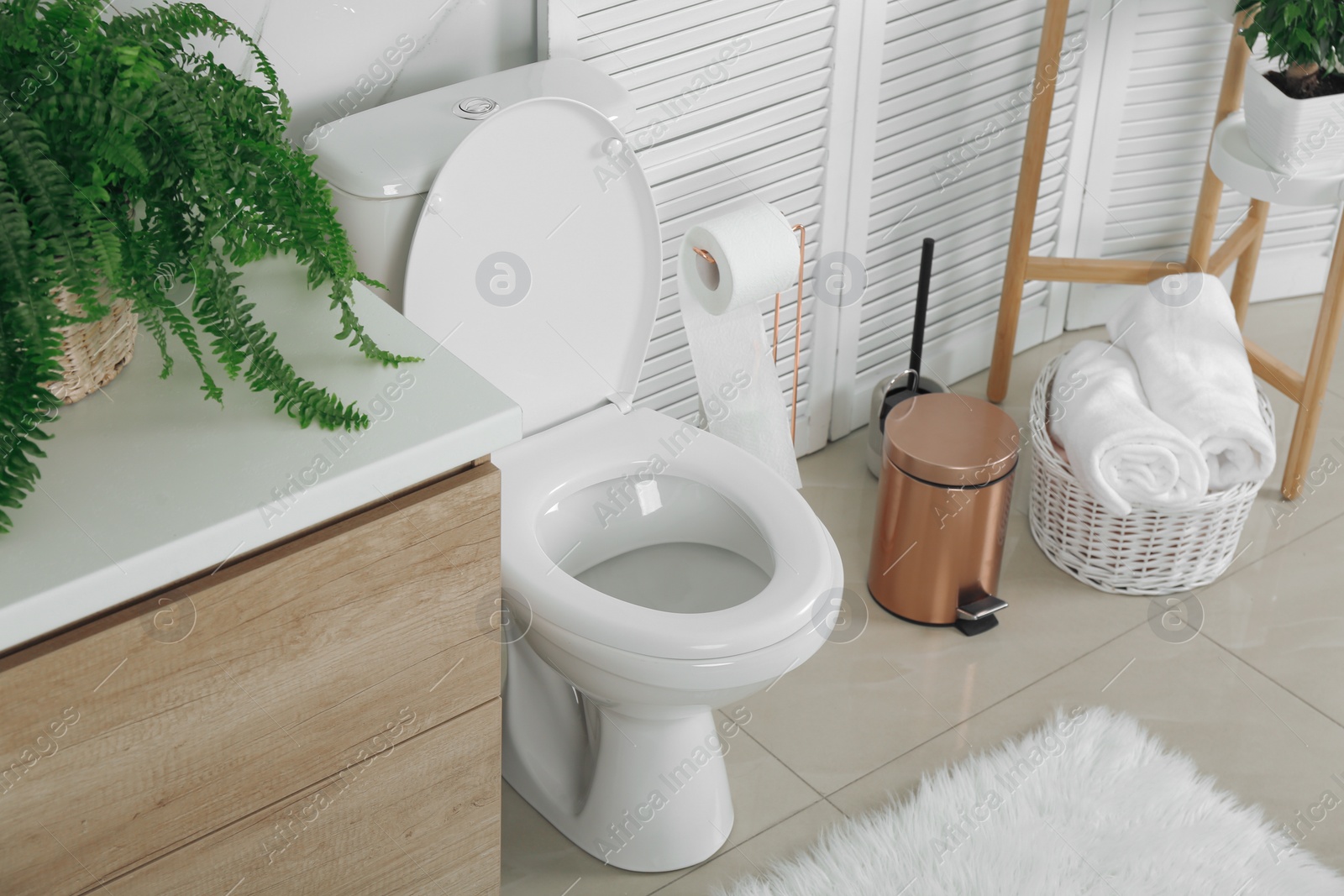 Photo of Stylish toilet bowl in modern bathroom interior