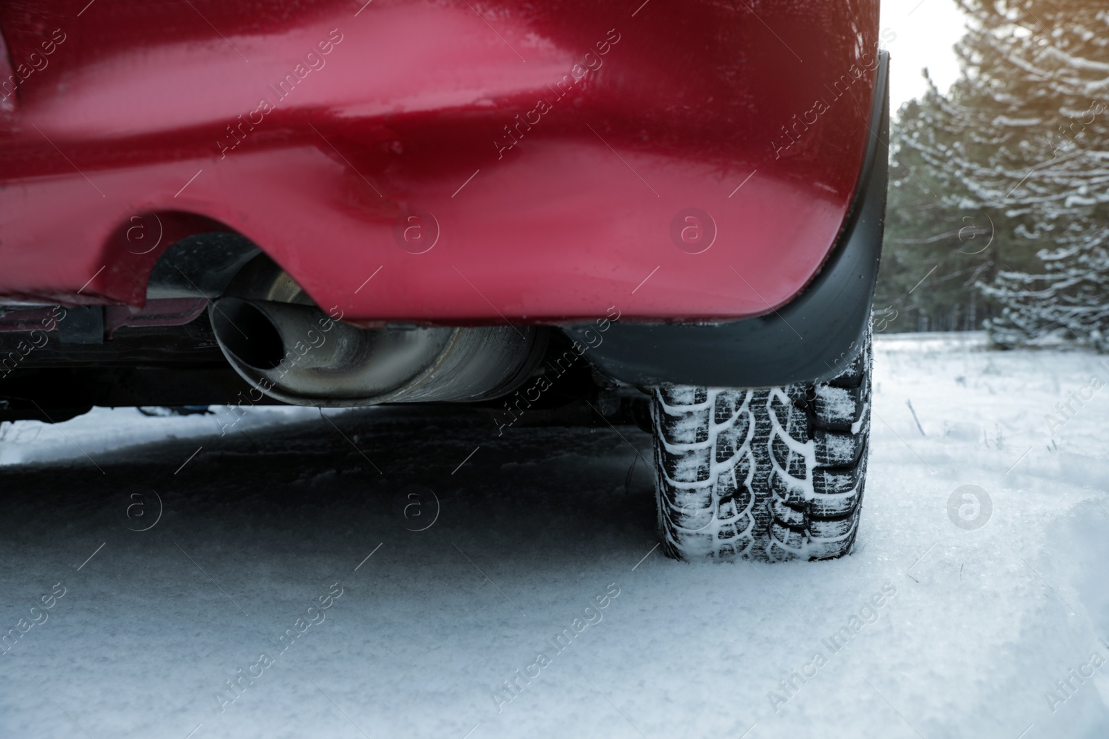 Photo of Car on snowy road, closeup. Winter season