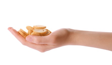 Photo of Woman holding crispy rusks on white background, closeup