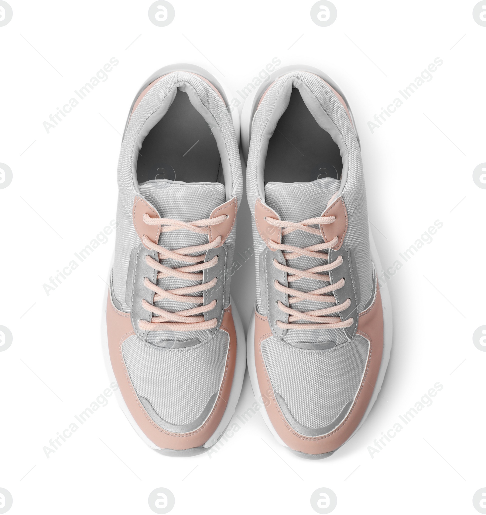 Photo of Pair of stylish sneakers on white background, top view