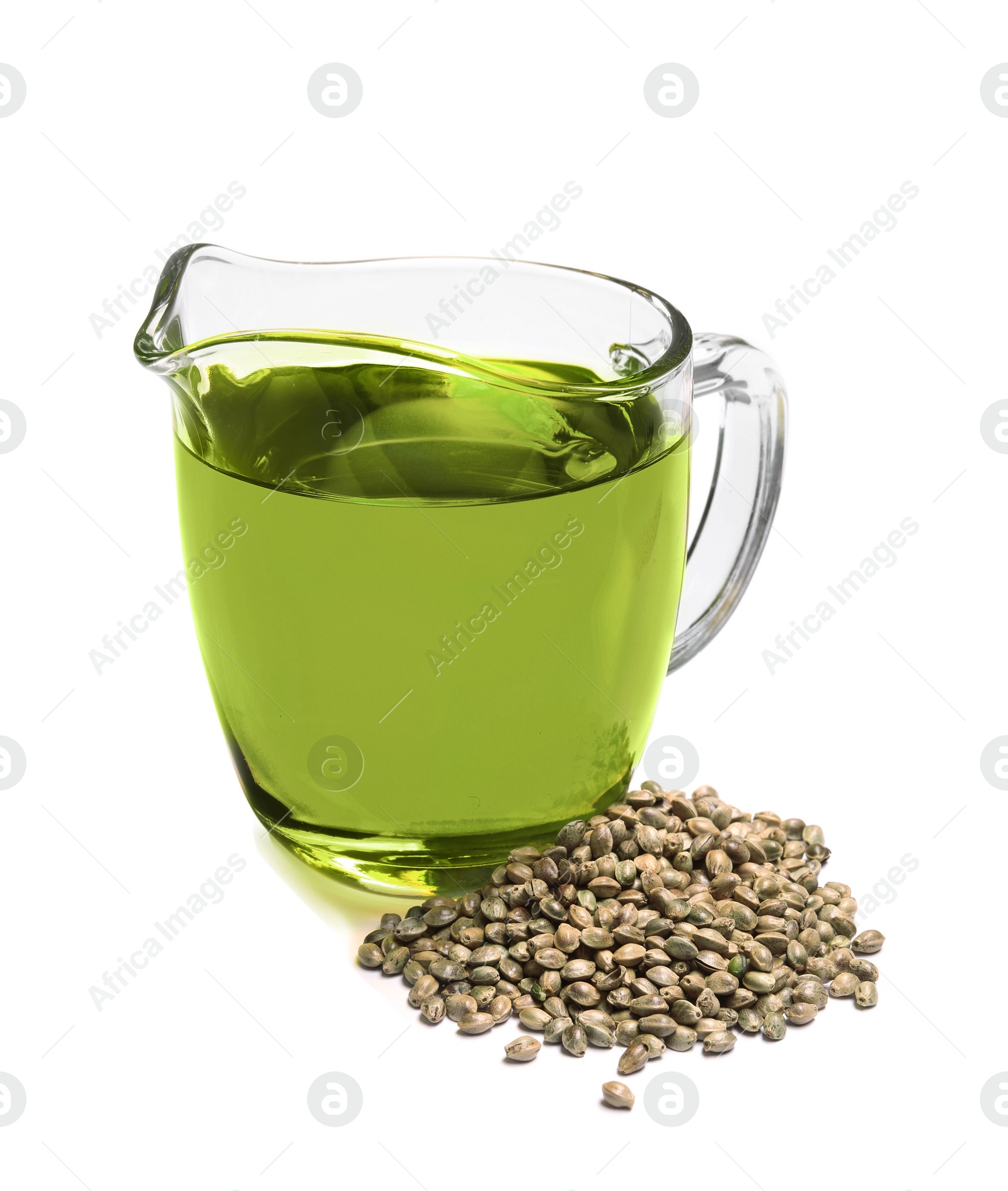 Photo of Jug with hemp oil and seeds on white background