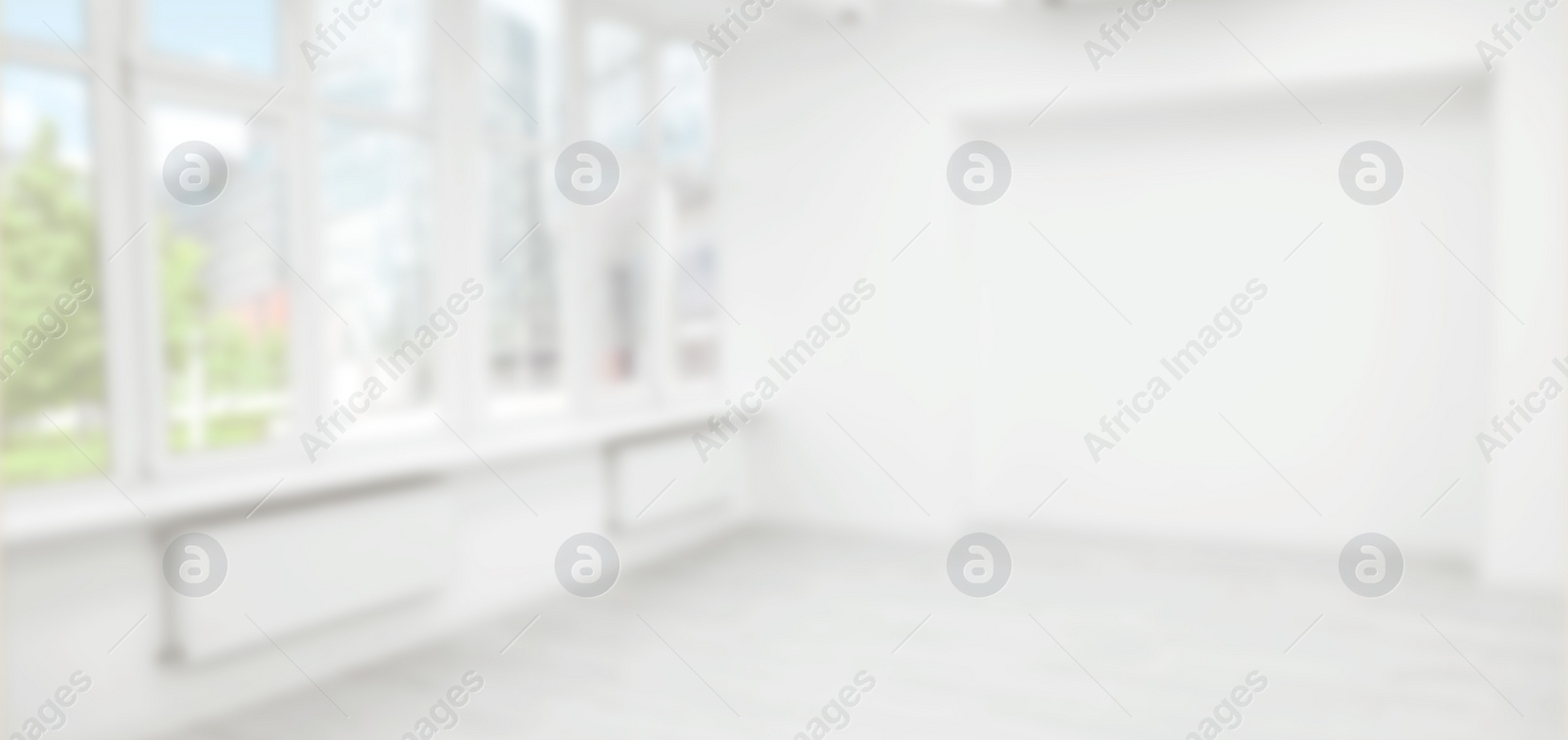 Image of Empty room with white wall and large window, blurred view. Banner design