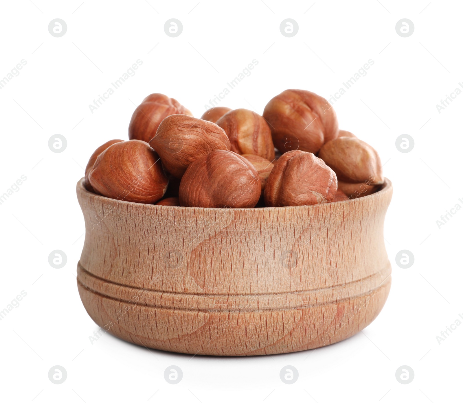 Photo of Bowl with tasty organic hazelnuts on white background