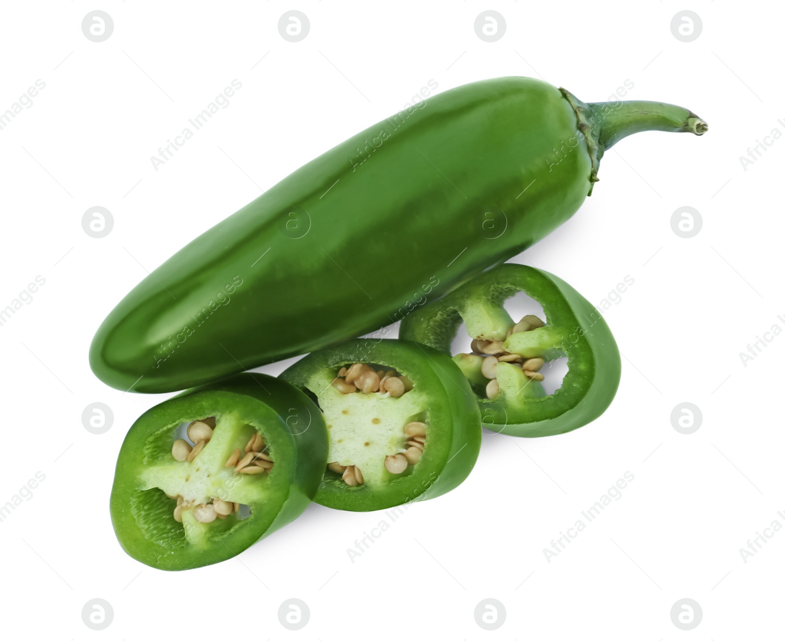 Photo of Whole and cut green hot chili peppers isolated on white, top view