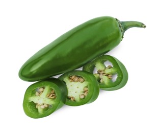 Photo of Whole and cut green hot chili peppers isolated on white, top view