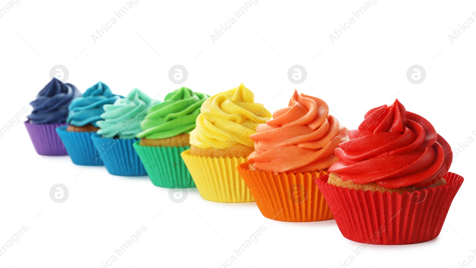 Photo of Delicious birthday cupcakes decorated with cream isolated on white