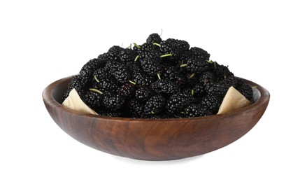 Ripe black mulberries in wooden bowl on white background