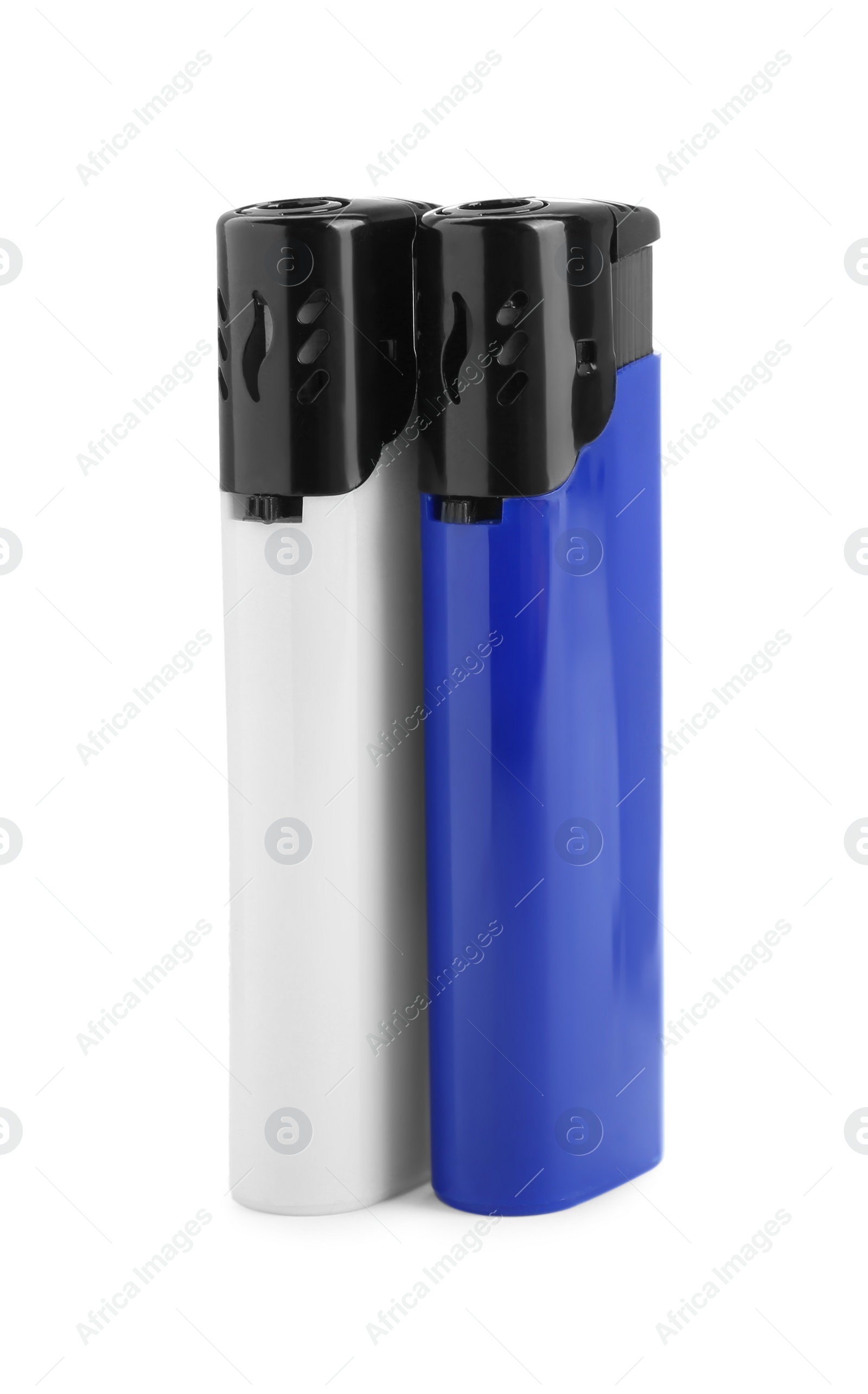 Photo of Stylish small pocket lighters on white background