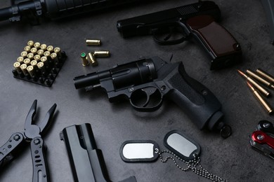 Photo of Composition with professional guns on black background, above view