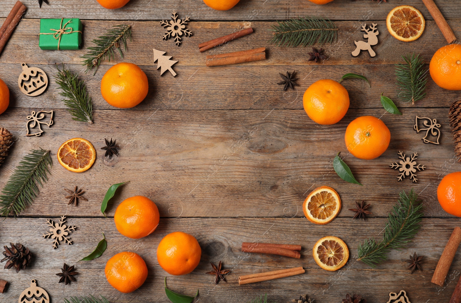 Photo of Flat lay composition with tangerines on wooden background. Space for text