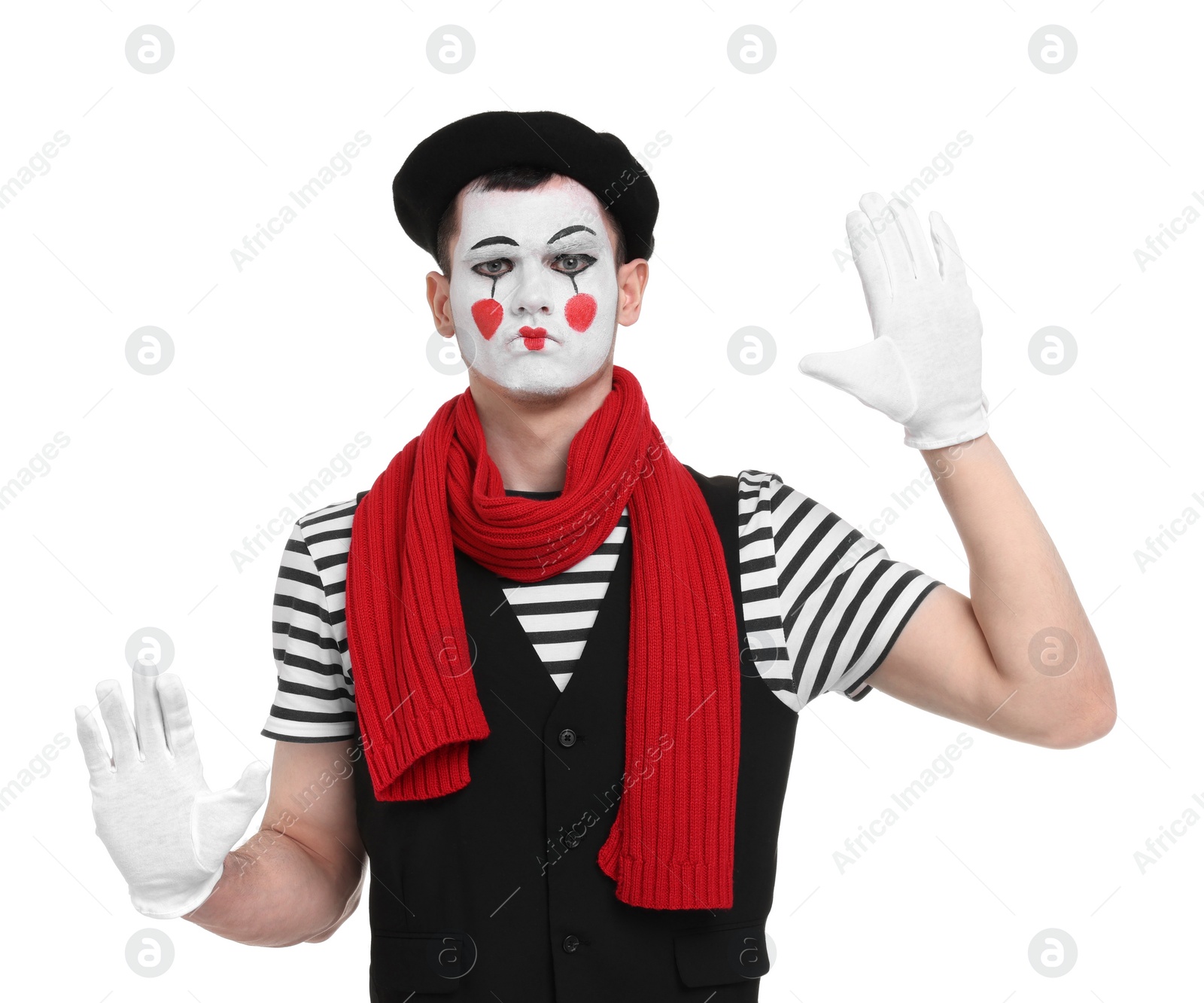 Photo of Funny mime artist in beret posing on white background