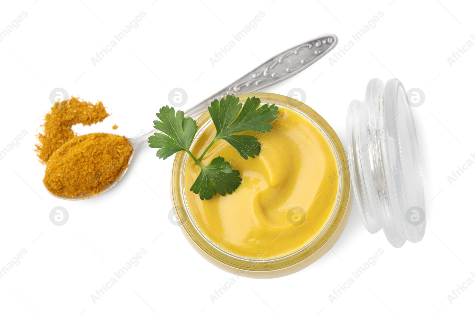 Photo of Jar with tasty curry sauce, powder and parsley isolated on white, top view