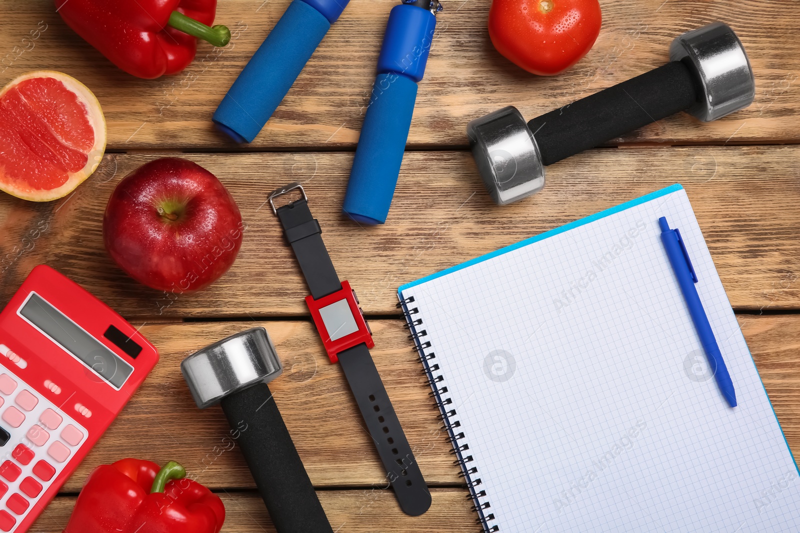 Photo of Flat lay composition with sport items, healthy food, notebook and space for text on wooden background. Weight loss concept