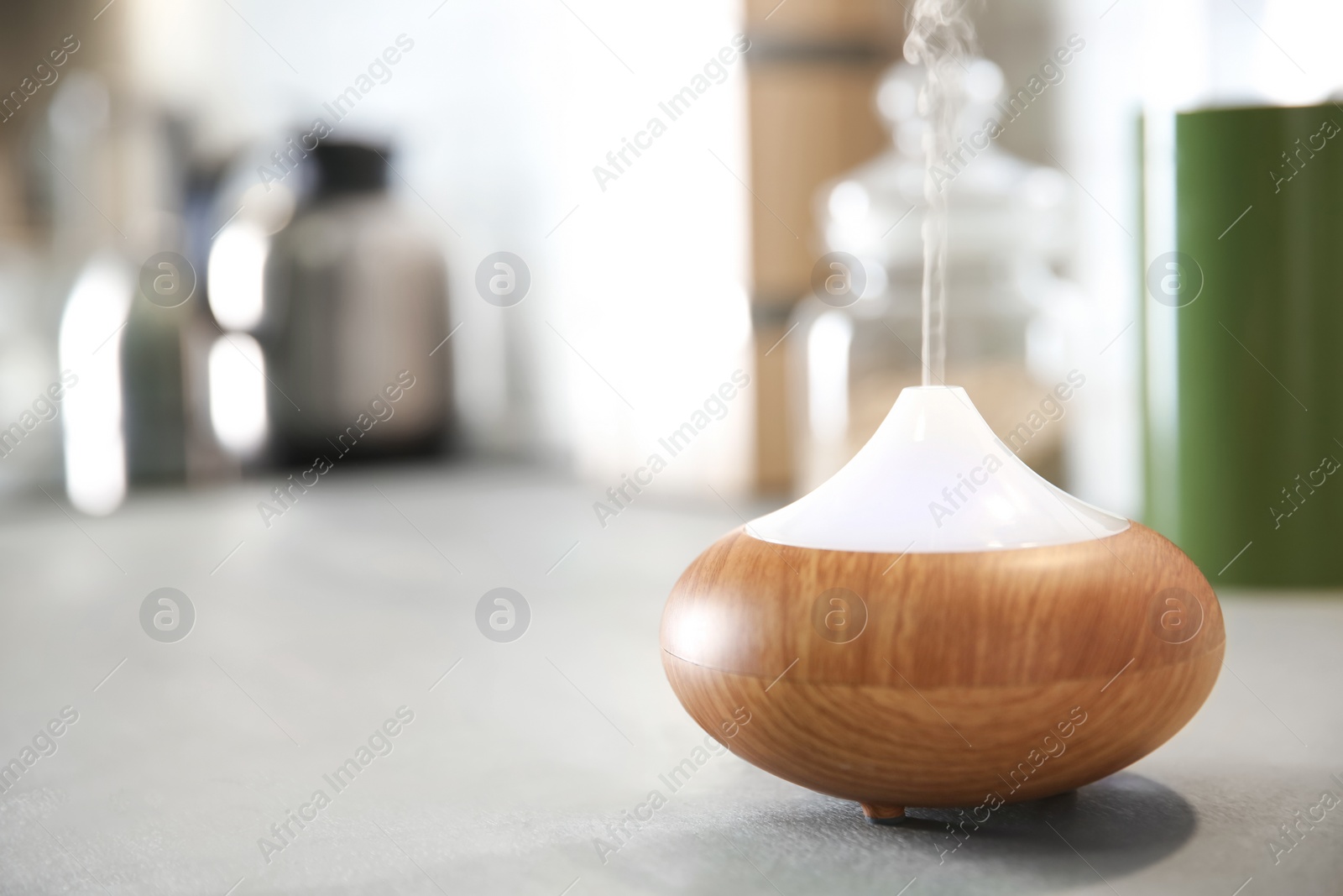 Photo of Aroma oil diffuser on table indoors