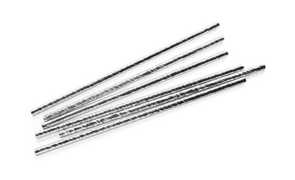 Photo of Silver plastic cocktail straws on white background, top view