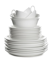 Photo of Stack of ceramic dishware on white background