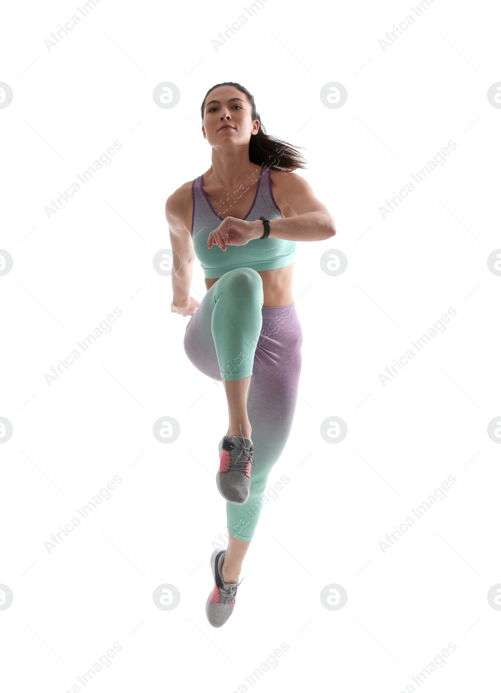 Photo of Athletic young woman running on white background