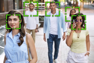 Facial recognition system identifying people on city street 