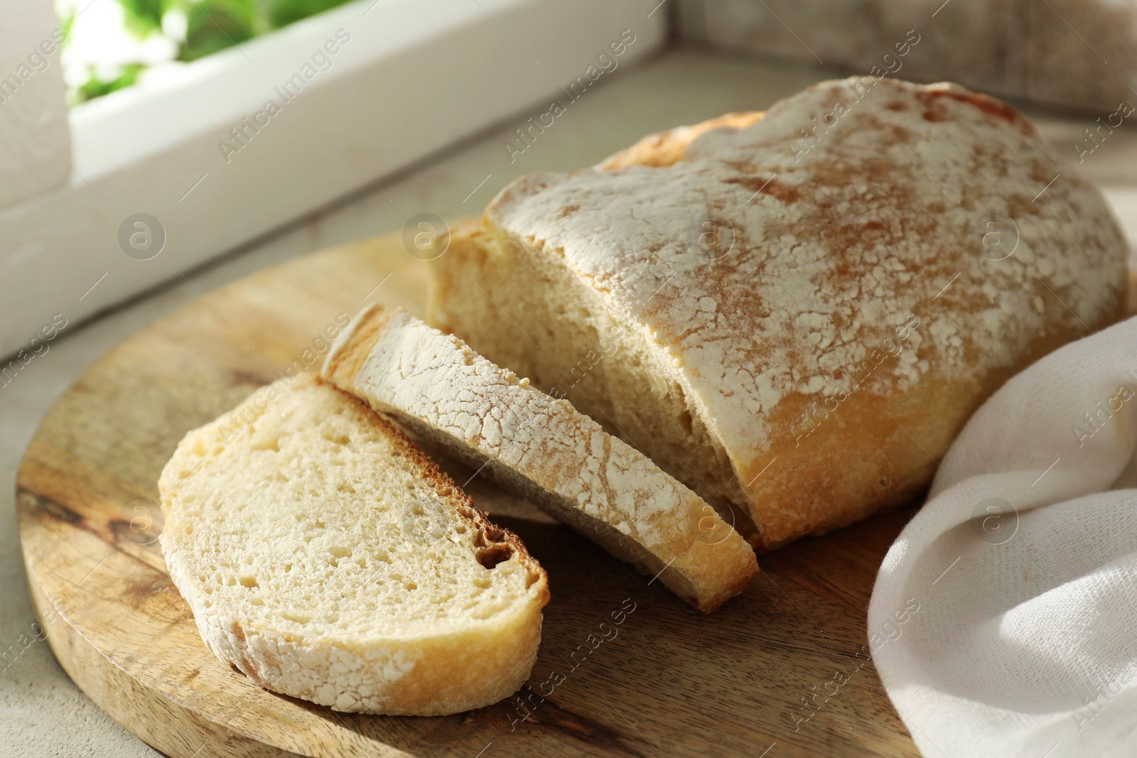 Photo of Freshly baked sourdough bread on light table