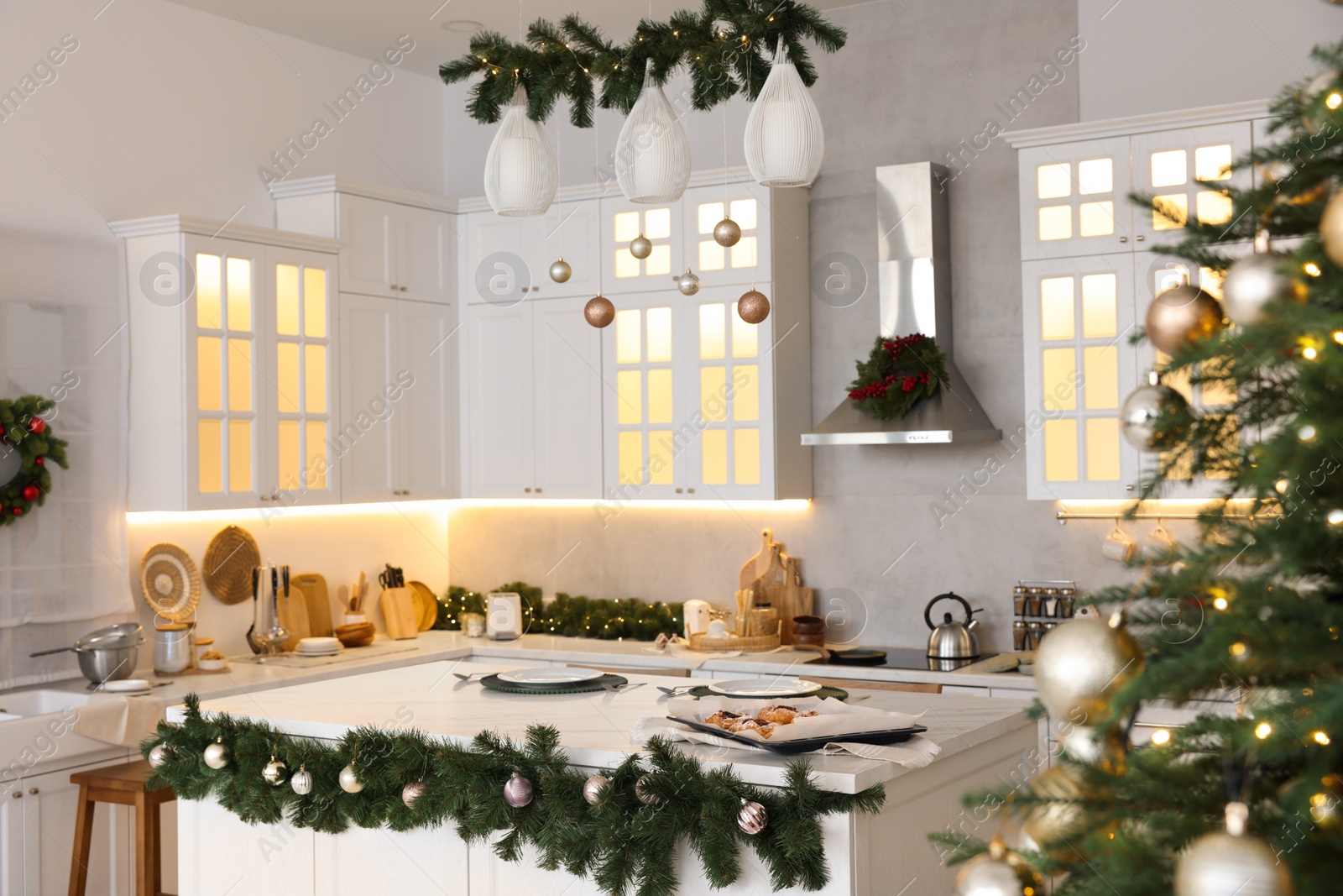 Photo of Cozy spacious kitchen decorated for Christmas. Interior design