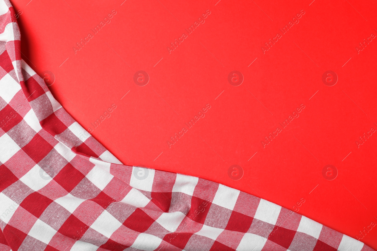 Photo of Checkered picnic blanket on color background, top view. Space for text