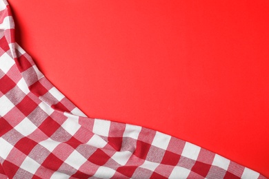 Photo of Checkered picnic blanket on color background, top view. Space for text