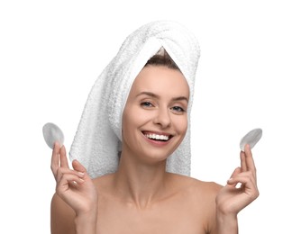 Removing makeup. Smiling woman with cotton pads on white background